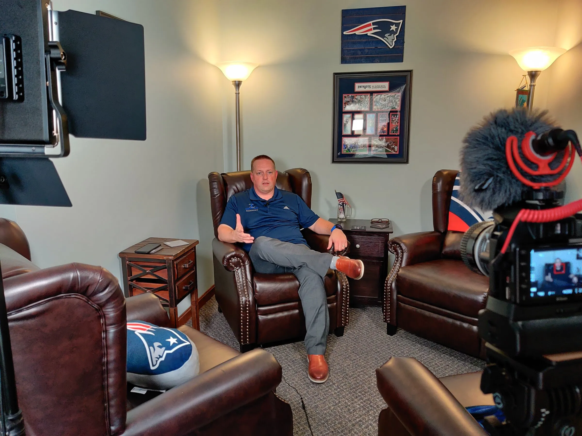 Camera and lights set up for an interview in a living room